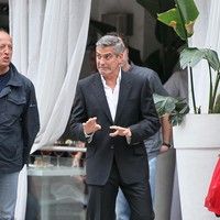 George Clooney on the set of a Mercedes Benz E300 L advert photos